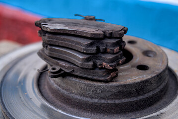 Four used car brake pads