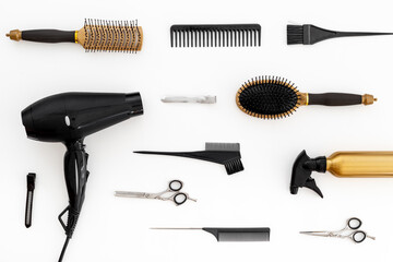 Pattern flat lay of hairdresser and barber tools and accessories on white background, top view