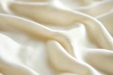 Obraz premium Soft, flowing white fabric drapes gracefully, creating elegant textures and shadows, ideal for fashion