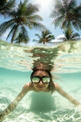Beautiful girl swimming in the sea with palm trees. Selective focus.