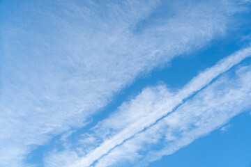 Clear blue sky with white cloud background
