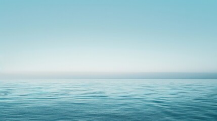 Obraz premium Tranquil Seascape: A Serene Ocean Vista Under a Pale Blue Sky