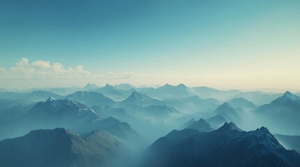 Majestic mountain ranges with layered blue ridges and a misty atmosphere, capturing the serene beauty of towering peaks and natural landscapes in the early morning light
