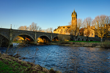 Peebles Old Parish Church by the River Tweed, which is 97 miles long from source to estuary and...