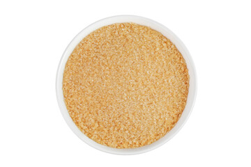 The brown sugar in ceramic bowl isolated on white background. Top view. Flat lay
