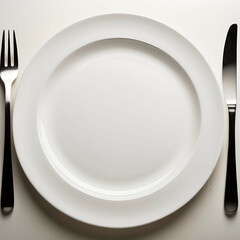 "Empty Plate, Full Meaning" &ndash; A clean white plate with a single fork resting, symbolizing simplicity in dining.