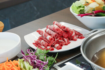 Shabu Shabu. Thinly sliced ​​beef on a plate