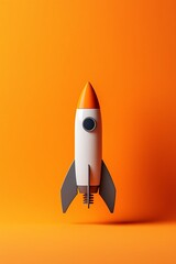 Obraz premium Vibrant Rocket on an Orange Background