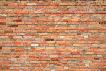 Old brick wall, old texture of red orange stone blocks