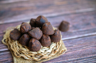 Chocolate truffles on wooden background