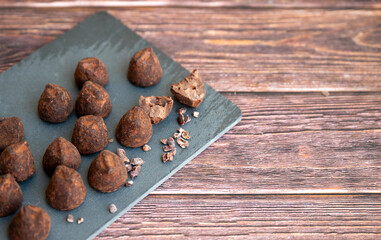 Chocolate truffles on wooden background