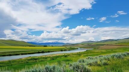 A beautiful green field with a majestic mountain, a clear river and a vast sky in the background. The idyllic and serene natural scenery creates a peaceful and charming atmosphere.