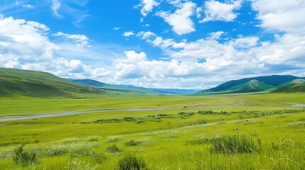 Obraz premium A beautiful green field with a majestic mountain, a clear river and a vast sky in the background. The idyllic and serene natural scenery creates a peaceful and charming atmosphere.