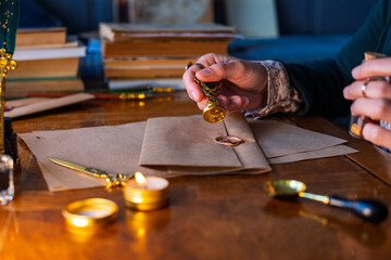 sealing wax. The girl seals the envelope with a wax seal.
