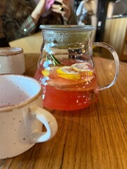 Fragrant hot tea. A teapot brewing hot tea with honey, lemon, mint. Spicy tea with spices. Immunity tea. Health concept. High quality photo.