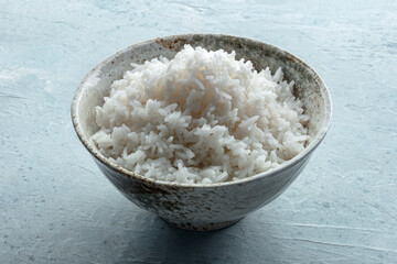 White rice, cooked. A bowl of boiled long grain rice, a simple side dish