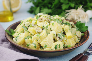 A bowl with Greek potato salads	