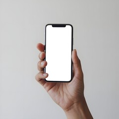 Photo of a hand holding a mobile phone. Plain white color is displayed on the smartphone.
