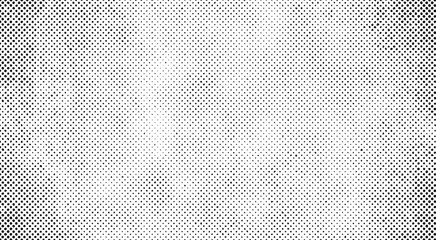 Vector halftone background with a black and white dotted subtle grunge vignette. Retro minimal backdrop design.