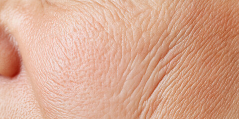 Fototapeta premium Close-up of Human Skin Texture with Wrinkles
