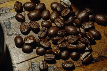 Fototapeta premium Close-up view of scattered coffee beans on wood