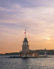 Fototapeta premium Historic Maiden's Tower, an iconic landmark in Istanbul, Turkey, standing on the Bosphorus at sunset. This centuries-old structure reflects the rich cultural and architectural heritage of the city