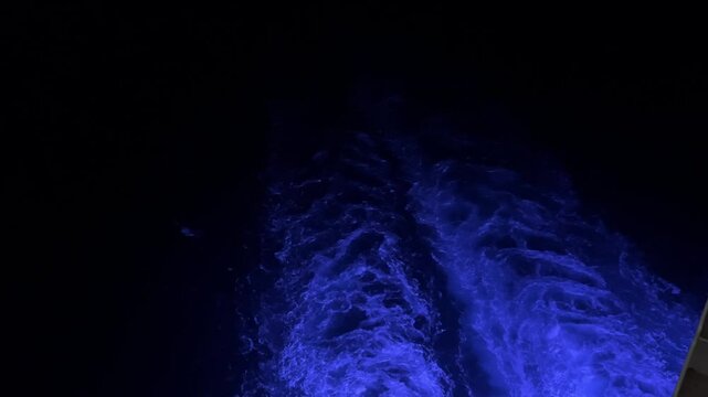 Perfect blue ocean wave breaks on the shore in the Maldives. Honeymoon surfing spot near the island of Himmafushi