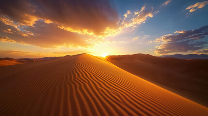 Majestic Sunset Over Towering Sand Dunes in a Vast Desert Landscape