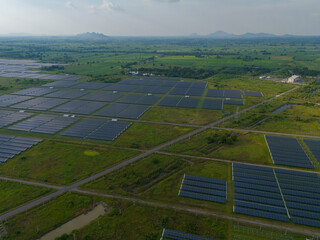 Aerial bird view photo of photovoltaic power station also known as a solar park is large-scale...