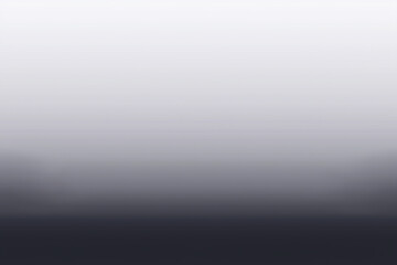Obraz premium Serene foggy landscape at dawn with silhouettes of trees and a soft gradient sky