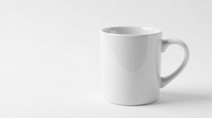 Fototapeta premium A Simple White Mug on a Plain White Background, Ideal for Mockups and Designs Requiring a Clean, Minimalist Aesthetic