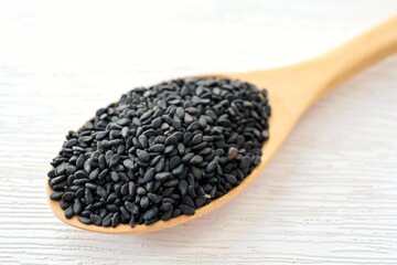 Hairy basil seed in wooden spoon on white background