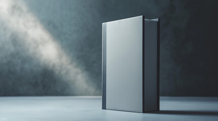 Blank book on a table with soft lighting