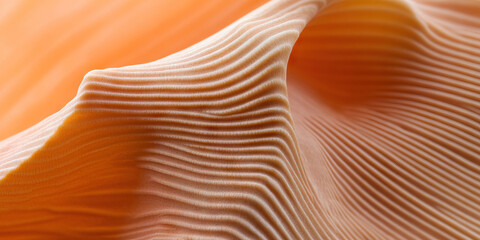 Obraz premium Close-up of Peach-Colored Textured Surface with Wave Pattern