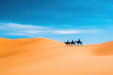 A group of people riding camels across a desert