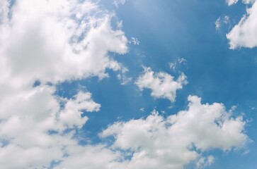Tranquil Blue Sky with Scattered White Clouds