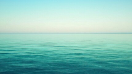 Obraz premium Serene Ocean View Under Clear Sky with Calm Water Reflection