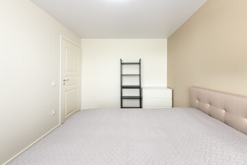 Minimalism Bedroom Interior. Wardrobe and Shelf in Background. Coffee Table and Light. Home.
