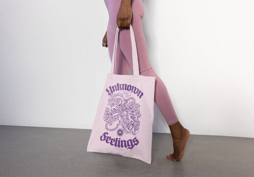 Stylish tote bag iholding by anonymous sport woman, ideal for showcasing your custom logo or personal artwork.