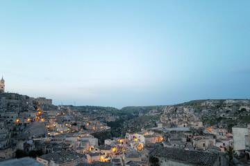Fototapeta premium Exterior aerial architecture and design at 'MATERA' Italian ancient cave dwellings inhabited since the Paleolithic, UNESCO World Heritage Site- Italy