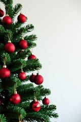 Classic Christmas tree with red ball decorations against a plain white wall, Ball Ornaments, Seasonal, Simple Decor