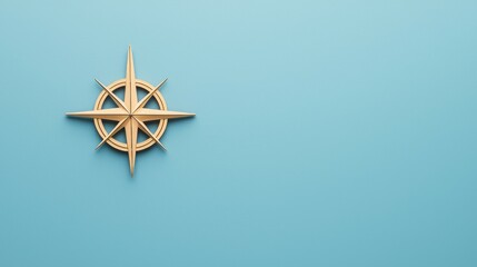 A golden compass rose on a light blue background, symbolizing navigation and direction.