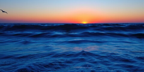 Obraz premium Shadows of waves on a blue canvas at sunset, natural scenery, calming hues, wave reflections