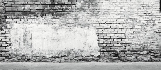 Obraz premium Black and white urban poster mockup on textured brick wall ideal for design business or advertising with ample empty copyspace for text