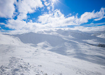Campo Felice, Italy - The suggestive plateau peak in Abruzzo region, Monte Puzzillo and Morretano summit mount range, during the winter with snow and alpinists in altitude