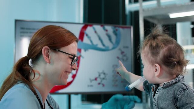 modern medicine, young smiling female doctor carefully examines a small child for collecting tests during a patient appointment in a medical laboratory