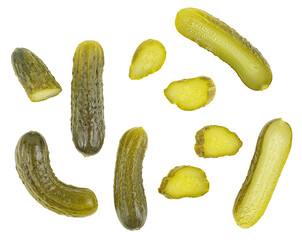 Set of pickle cucumbers and slices isolated on a white background. Marinated small cut green cucumbers, top view.