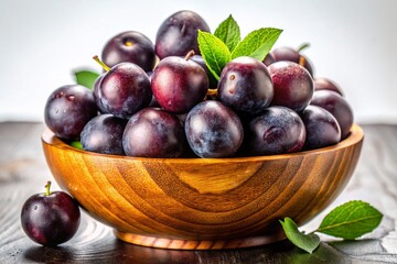 Fototapeta premium Bowl of Fresh Jabuticabas on White Background - Brazilian Grapes Stock Photo