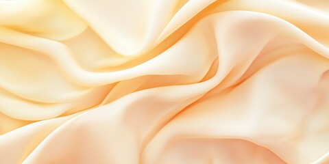 Fototapeta premium Soft Silk Fabric Texture in Gentle Peach and Cream Tones for Design Use