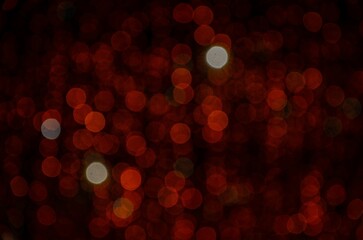 red flashlight stars (blur) on a black background
